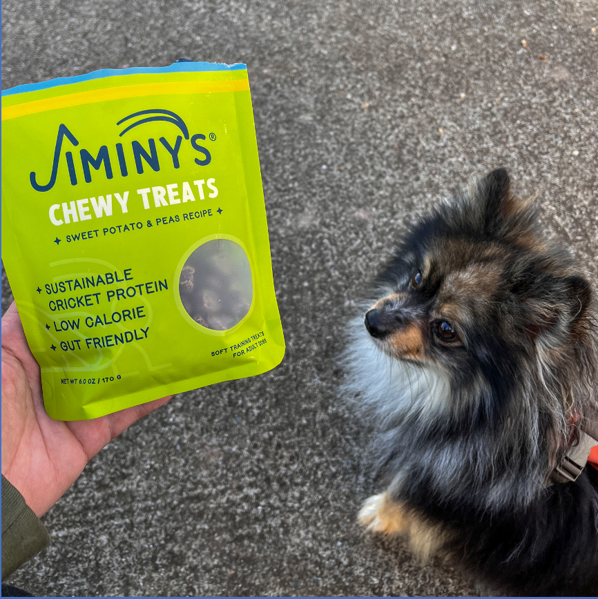 og with a bag of Jiminy's Soft and Chewy Sweet Potato & Peas Dog Training Treats